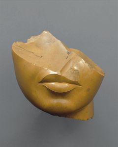 Fragment of a Queen's Face, New Kingdom, 18th dynasty, reign of Akhenaten.  From Middle Egypt, probably el-Amarna/Akhetaten (c. 1353–1336 BCE, yellow jasper, 5⅛ x 4⅞ x 4⅞ in [13 x 12.5 x 12.5 cm]).  The Metropolitan Museum of Art.  Photograph by Bruce White. © The Metropolitan Museum of Art.